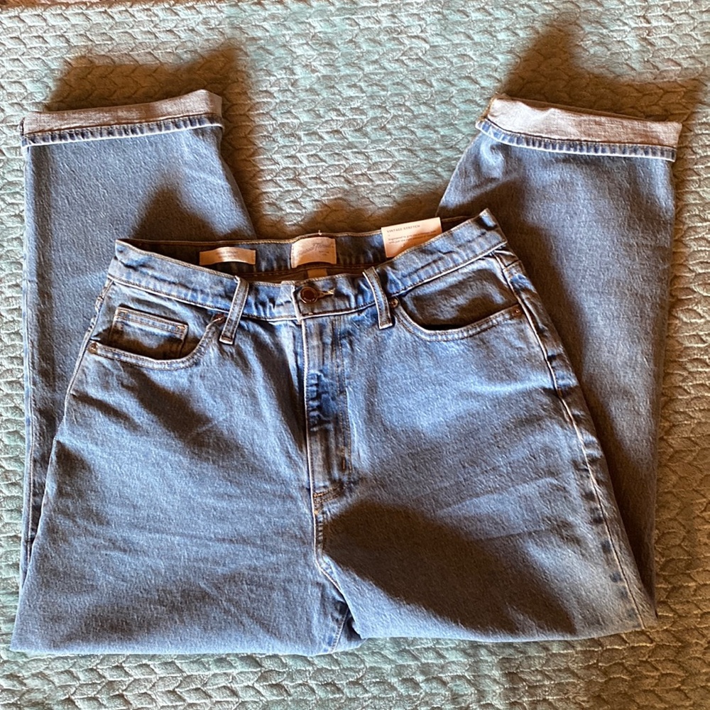 Never worn. High waisted, slim hip and straight leg